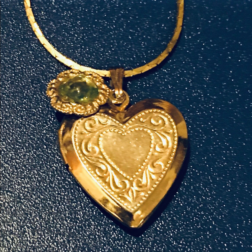 Gold plated charms with Olivine stone the heart opens.
